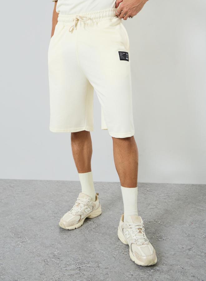 Styli Men Oversized Badge Detail T-Shirt and Shorts Co-Ords - Image 4